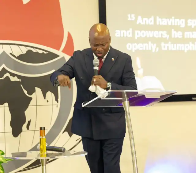 Our Resident Pastor making a point mid message, Colossians 2:15 on the screen behind him